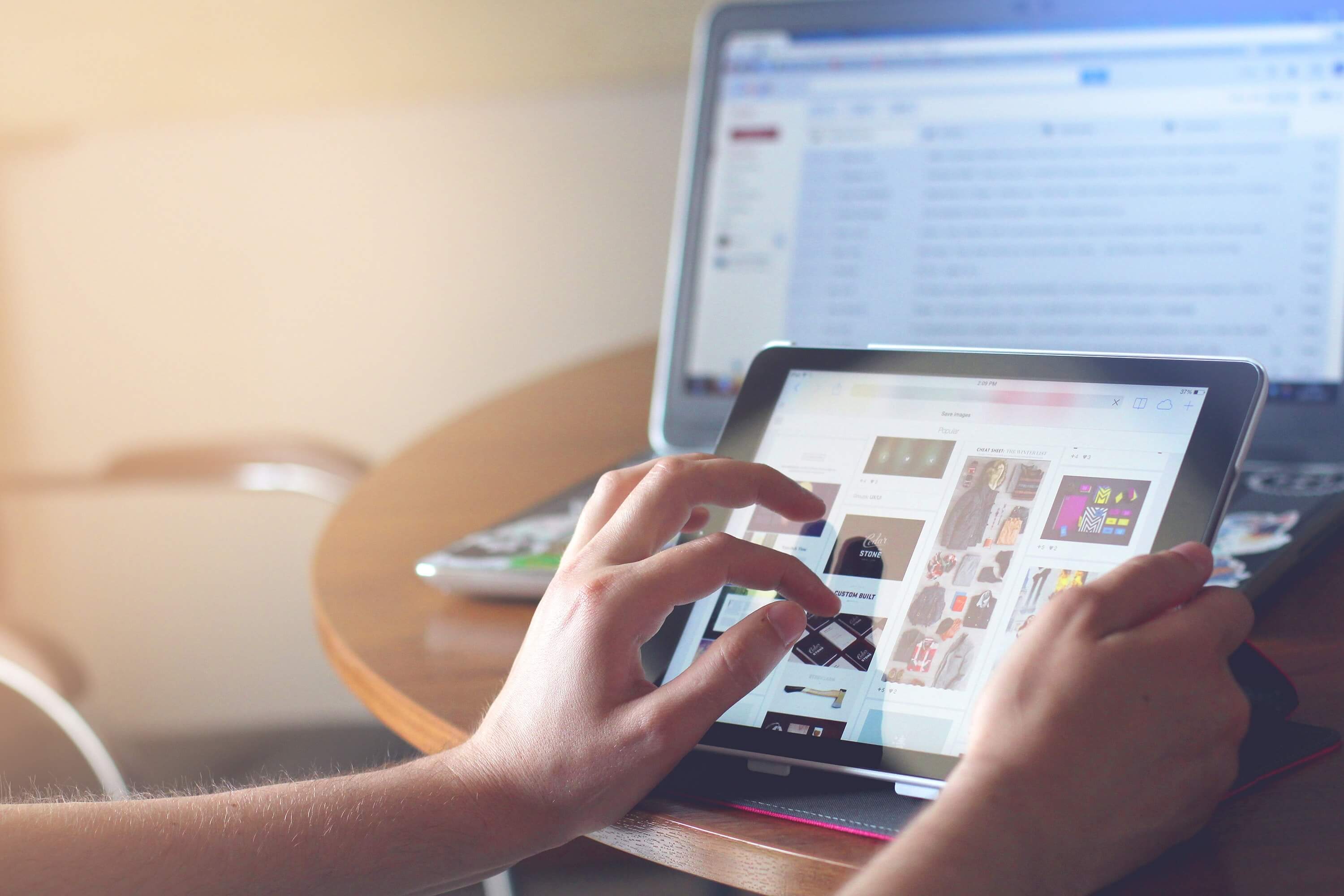person editing website design on a tablet